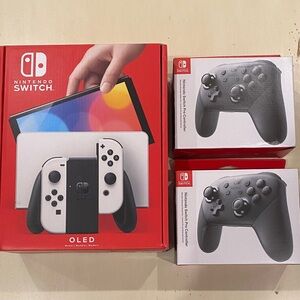 Nintendo Switch OLED and 2 PRO controllers NEW in box